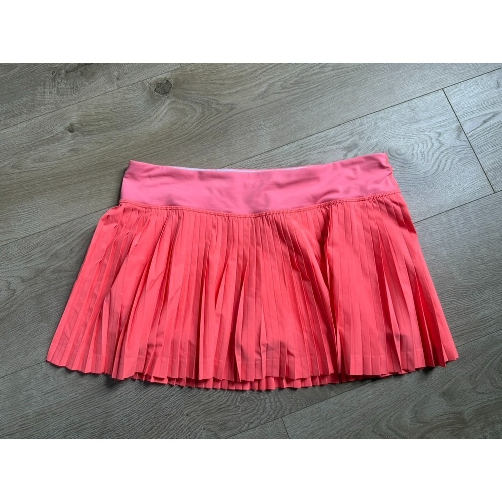 EUC Women Lululemon Pleat To Street Skirt II Grapefruit neon tennis skirt Size 8